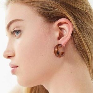 Urban Outfitters Corinne resin hoop earrings.
